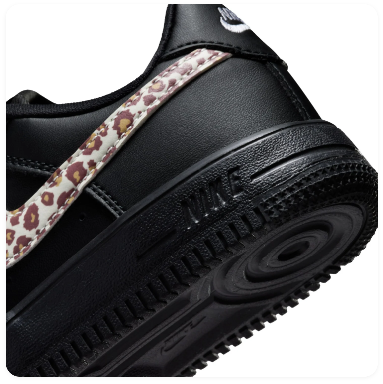 Nike Low-Top Sneakers – Black with Leopard-Print Swoosh